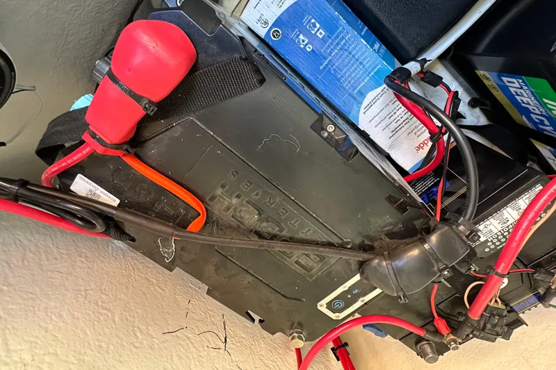 Slide: The Image of Battery compartment of a 2023 Parker 1801 Center Console boat with wiring connections. - 20