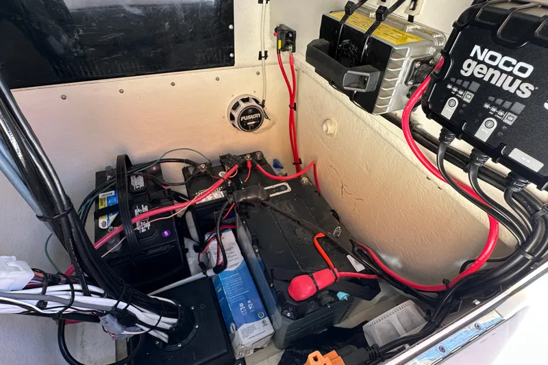 Slide: The Image of Interior view of 2023 Parker 1801 Center Console boat with battery setup and wiring. - 21
