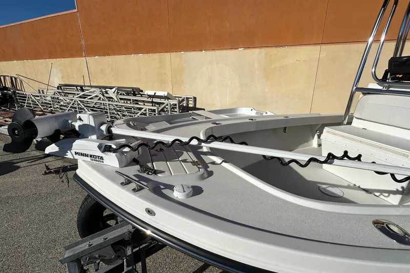 Slide: The Image of 2023 Parker 1801 Center Console boat with Minn Kota trolling motor, docked outdoors. - 3