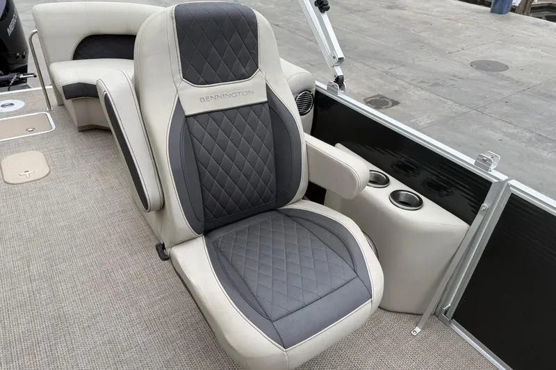 Slide: The Image of Luxurious seating on 2020 Bennington 22 SSRFBXP pontoon boat with cup holders and quilted upholstery. - 12