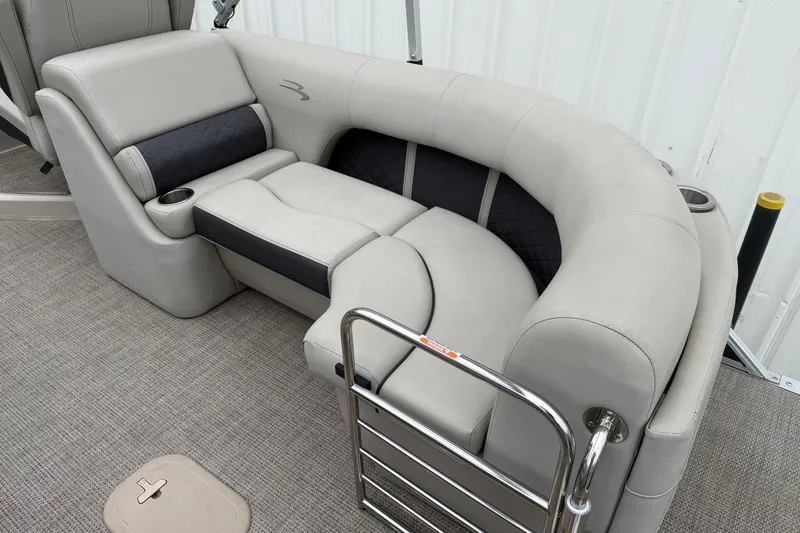 Slide: The Image of 2020 Bennington 22 SSRFBXP boat interior with plush seating and cup holders. - 15