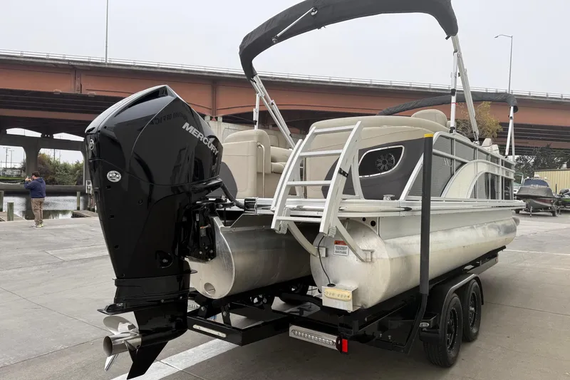 Slide: The Image of 2020 Bennington 22 SSRFBXP pontoon boat with Mercury outboard engine on trailer. - 3