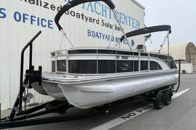 Slide: The Image of 2020 Bennington 22 SSRFBXP pontoon boat on trailer at a boatyard. - 6