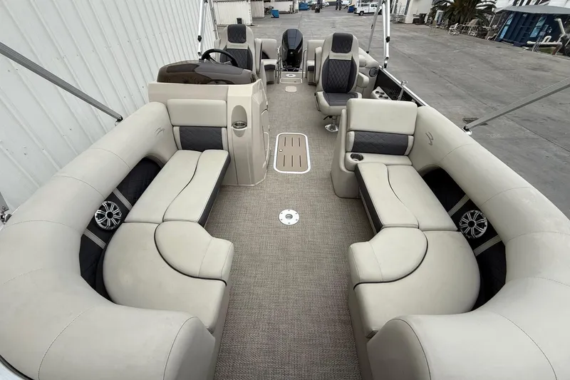 Slide: The Image of 2020 Bennington 22 SSRFBXP pontoon boat interior with plush seating and modern design. - 7