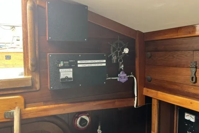 Slide: The Image of 1977 Alajuela A38 interior with wooden paneling and control panel. - 11