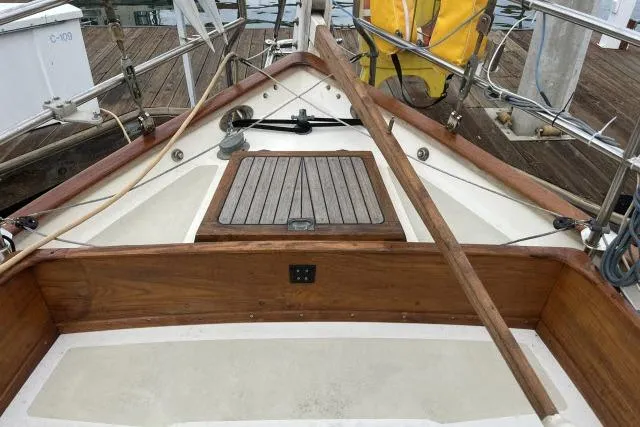 Slide: The Image of 1977 Alajuela A38 sailboat deck with wooden accents and nautical equipment. - 20
