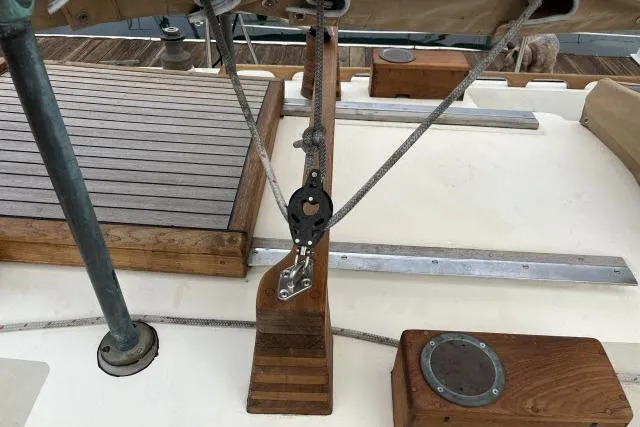 Slide: The Image of Deck of 1977 Alajuela A38 sailboat with wooden fittings and rigging details. - 22