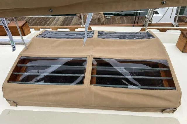 Slide: The Image of 1977 Alajuela A38 sailboat hatch with protective cover and clear windows. - 26