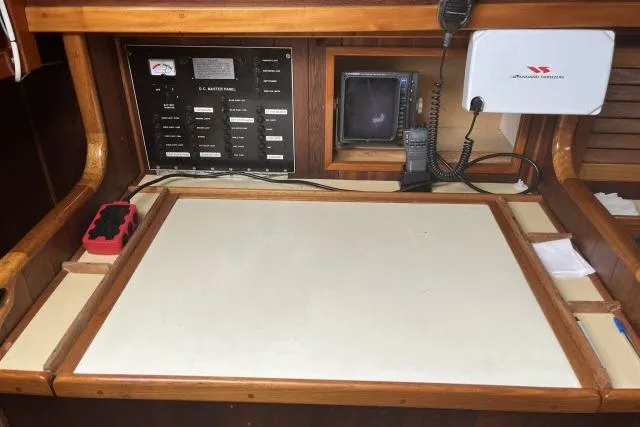 Slide: The Image of Navigation station of 1977 Alajuela A38 sailboat with control panel and communication equipment. - 8
