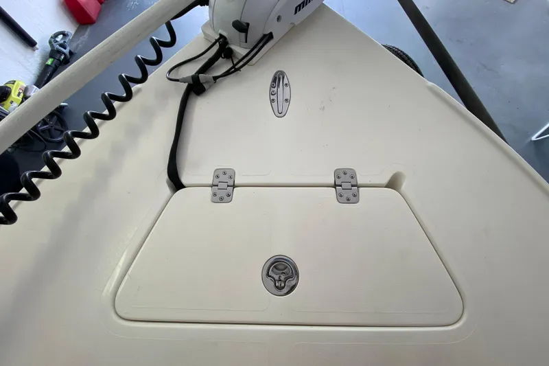 Slide: The Image of Bow deck of 2008 Famous Craft 18 boat with storage hatch and trolling motor. - 20