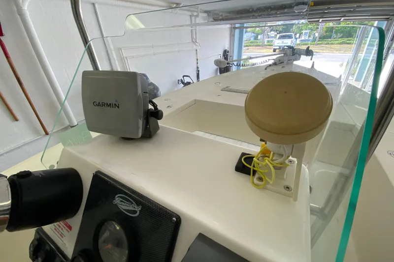 Slide: The Image of 2008 Famous Craft 18 boat dashboard with Garmin GPS and navigation equipment. - 42
