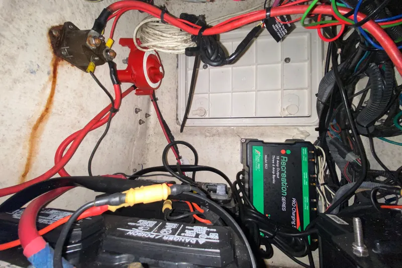 Slide: The Image of Electrical wiring and battery setup in a 2008 Famous Craft 18 boat. - 48