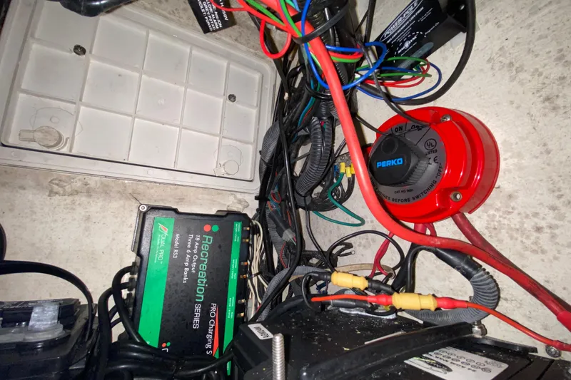 Slide: The Image of Electrical wiring and components inside a 2008 Famous Craft 18 boat. - 49