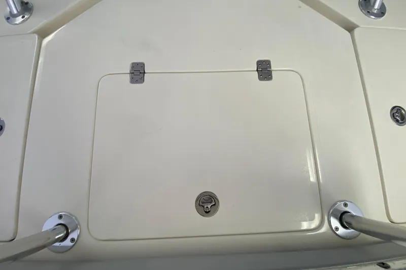 Slide: The Image of Hatch on 2008 Famous Craft 18 boat deck with metal fittings. - 60