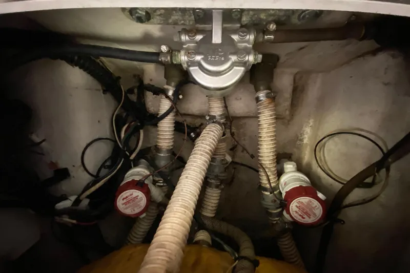 Slide: The Image of Boat plumbing system in a 2008 Famous Craft 18, featuring hoses and valves. - 69