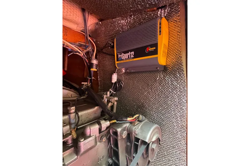 Slide: The Image of Engine compartment of a 1978 Hunter 30 sailboat with ProSport12 charger. - 35