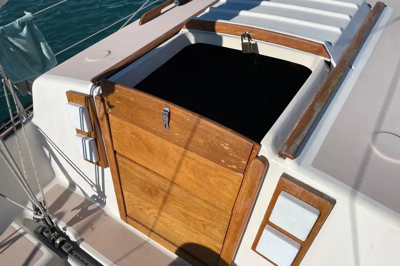 Slide: The Image of 1978 Hunter 30 sailboat cockpit with wooden hatch and nautical details. - 7