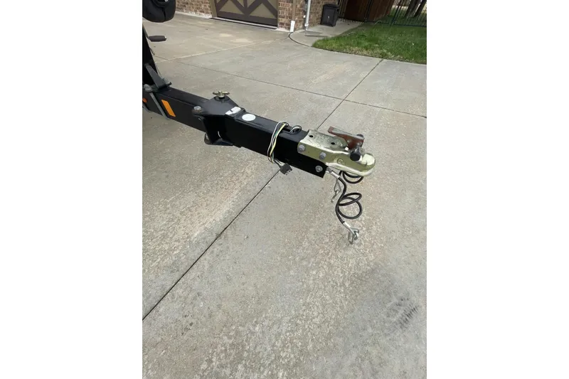 Slide: The Image of Trailer hitch of a 2011 Sea Ray 175 Sport on a concrete driveway. - 10
