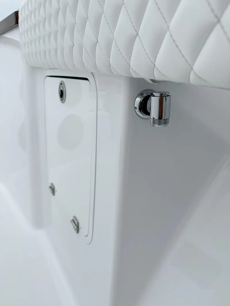 Slide: The Image of 2025 HCB 48 Campeon boat interior detail with quilted upholstery and chrome fixture. - 18