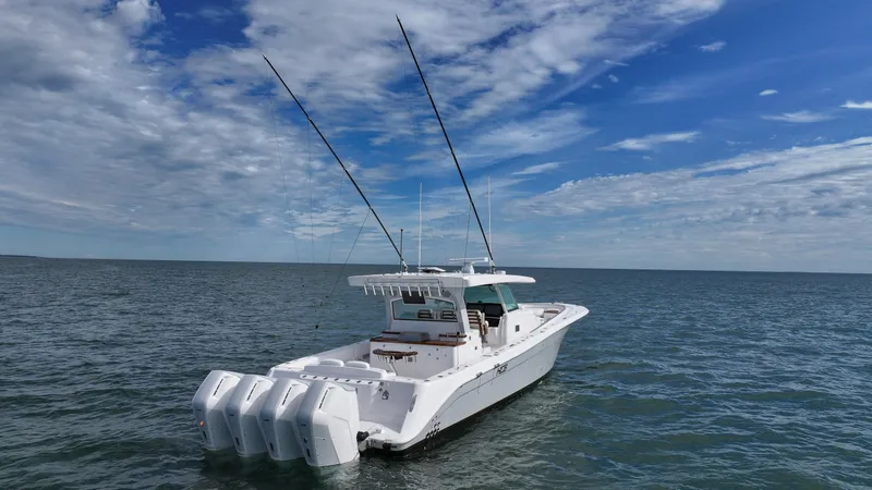 Slide: The Image of 2025 HCB 48 Campeon boat on open water under a blue sky. - 2