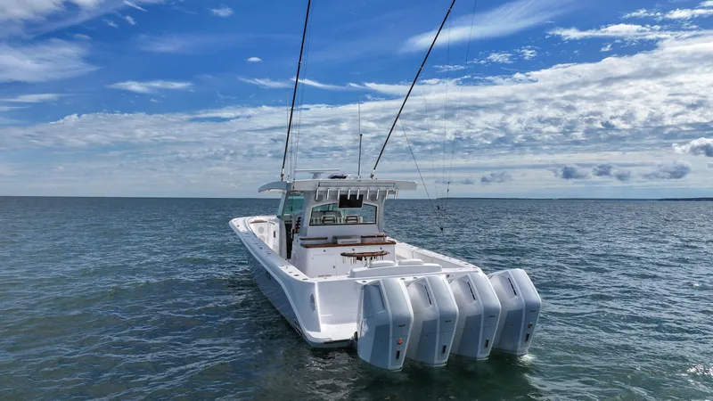 Slide: The Image of 2025 HCB 48 Campeon boat with multiple engines on open water. - 3