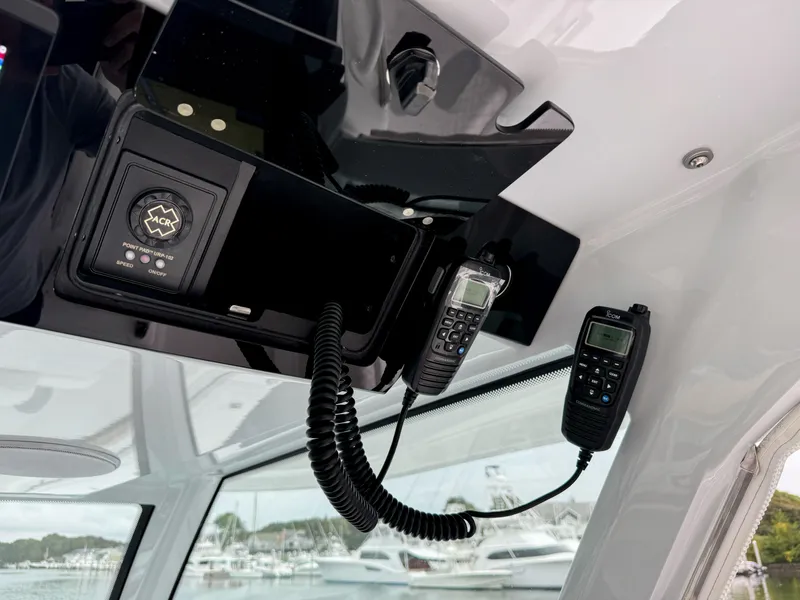 Slide: The Image of 2025 HCB 48 Campeon boat interior with communication devices and control panel. - 35