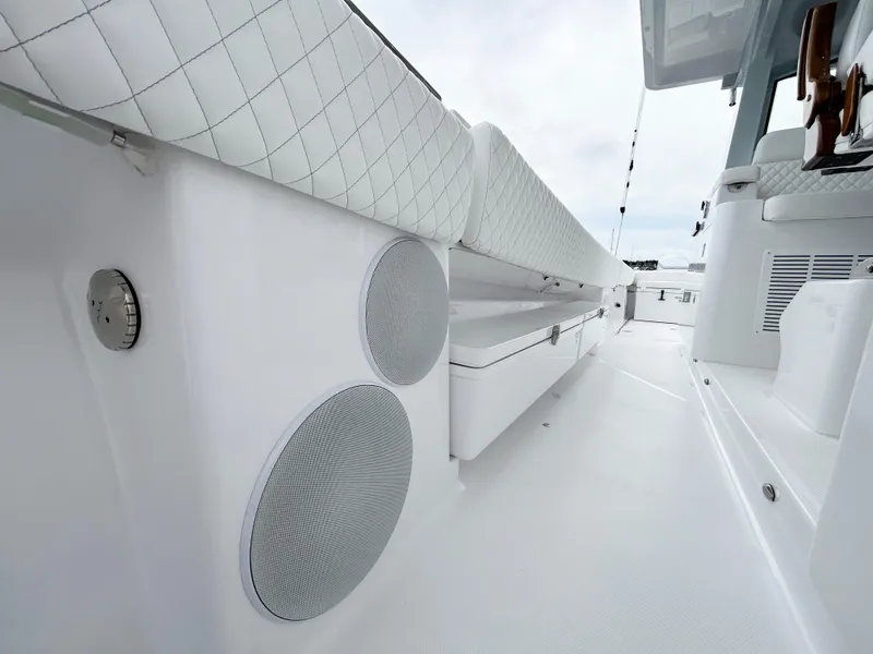Slide: The Image of 2025 HCB 48 Campeon boat interior with white seating and built-in speakers. - 40