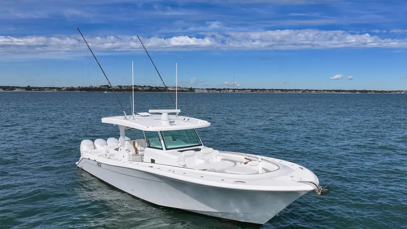 Slide: The Image of 2025 HCB 48 Campeon boat on open water under blue sky. - 5