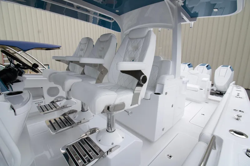 Slide: The Image of 2025 HCB 42 Lujo boat interior with luxurious white seating and modern design. - 15
