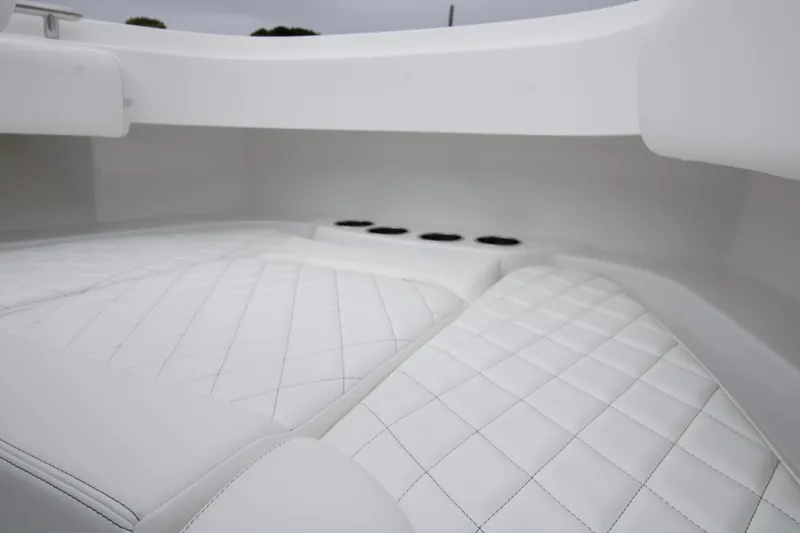 Slide: The Image of 2025 HCB 42 Lujo boat with luxurious white seating and sleek design. - 4
