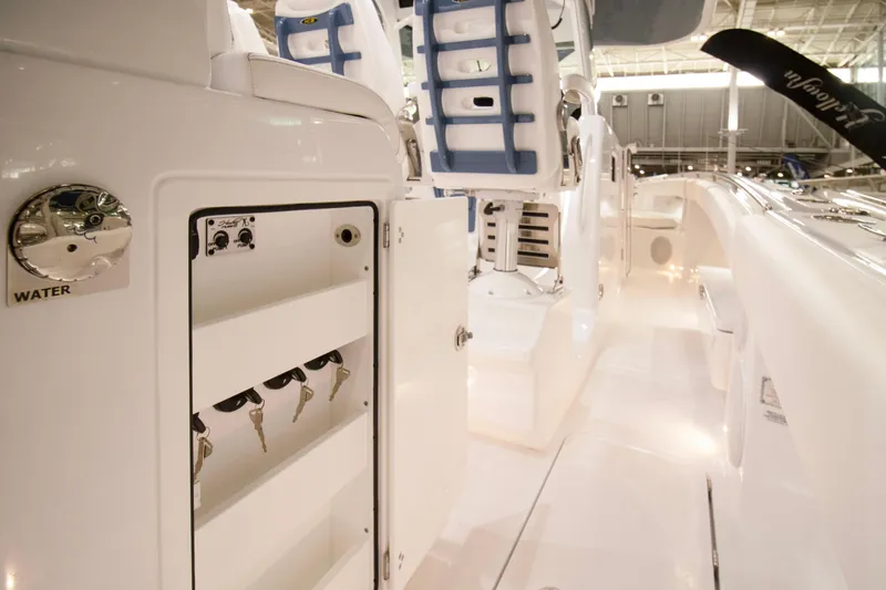 Slide: The Image of 2025 HCB 42 Lujo luxury boat interior with white seating and cup holders. - 45