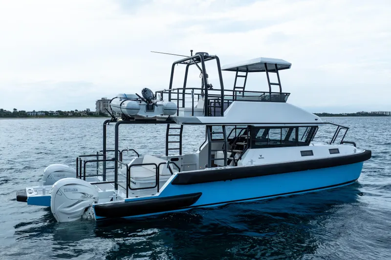 Slide: The Image of 2023 Vandal 46 Explorer boat on water, featuring Yamaha engines and modern design. - 13