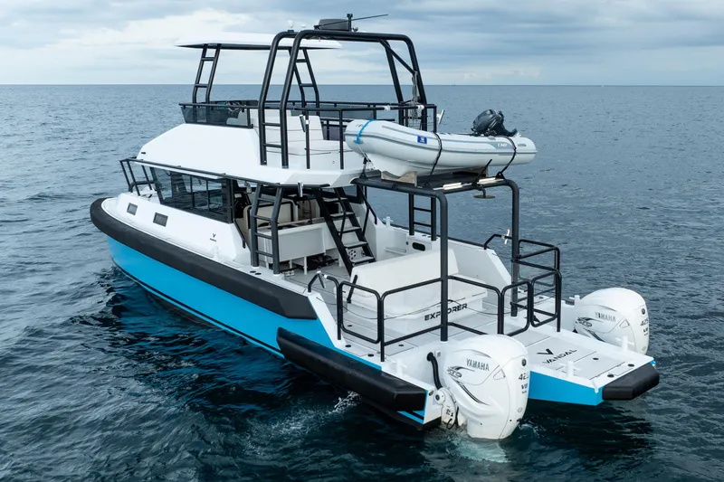 Slide: The Image of 2023 Vandal 46 Explorer boat with Yamaha engines on open sea. - 14