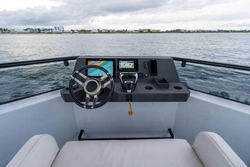 Slide: The Image of Helm of 2023 Vandal 46 Explorer boat with modern navigation equipment. - 19