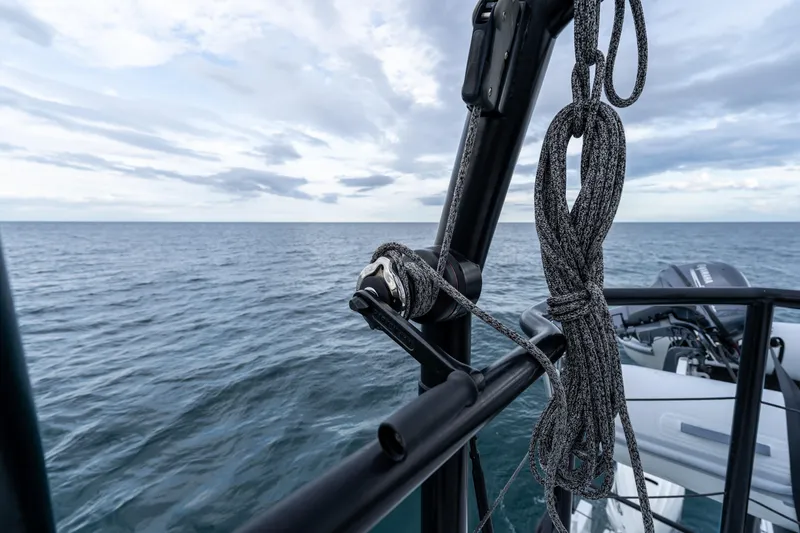 Slide: The Image of 2023 Vandal 46 Explorer yacht detail with ocean backdrop and rigging ropes. - 28