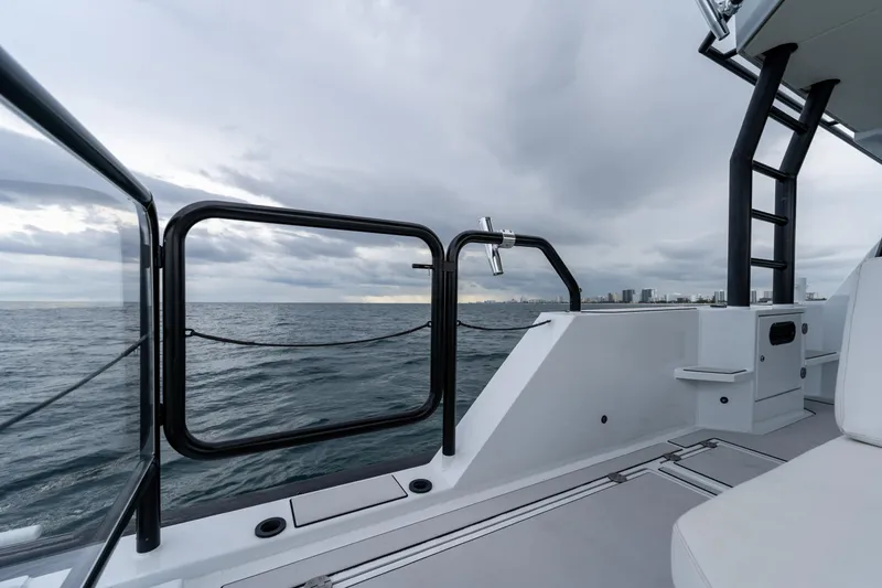 Slide: The Image of 2023 Vandal 46 Explorer yacht deck with ocean view and city skyline. - 34