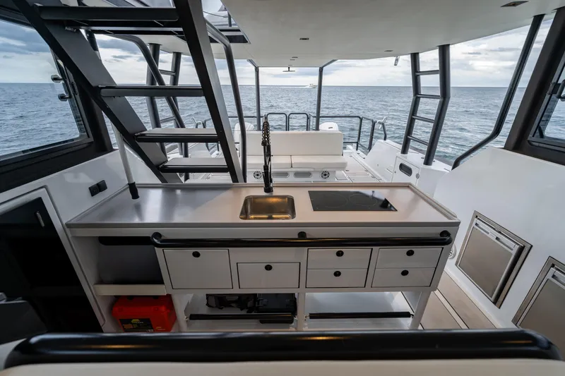 Slide: The Image of Modern kitchen area on 2023 Vandal 46 Explorer yacht with ocean view. - 36