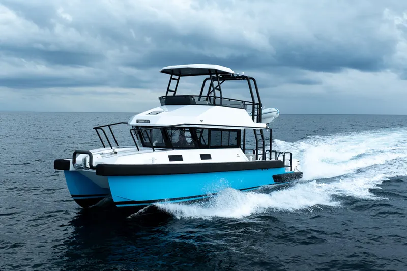 Slide: The Image of 2023 Vandal 46 Explorer cruising on open sea under cloudy skies. - 4