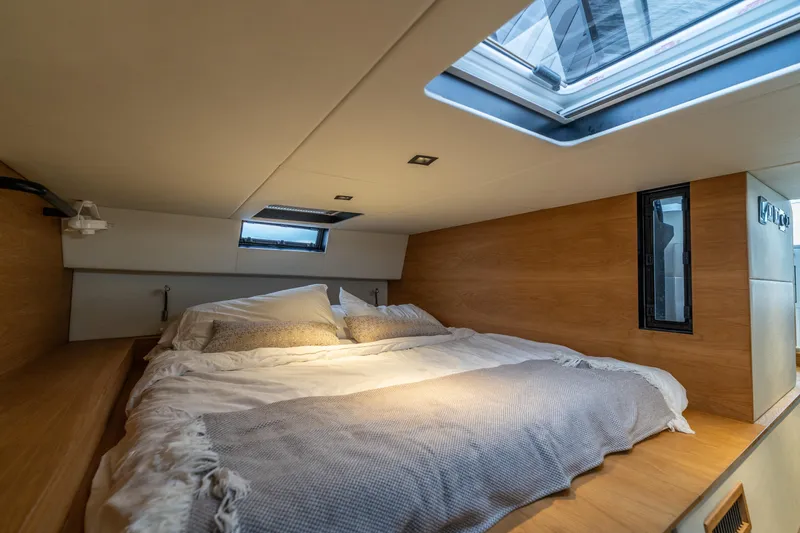 Slide: The Image of Cozy cabin interior of 2023 Vandal 46 Explorer with skylight and wooden accents. - 50