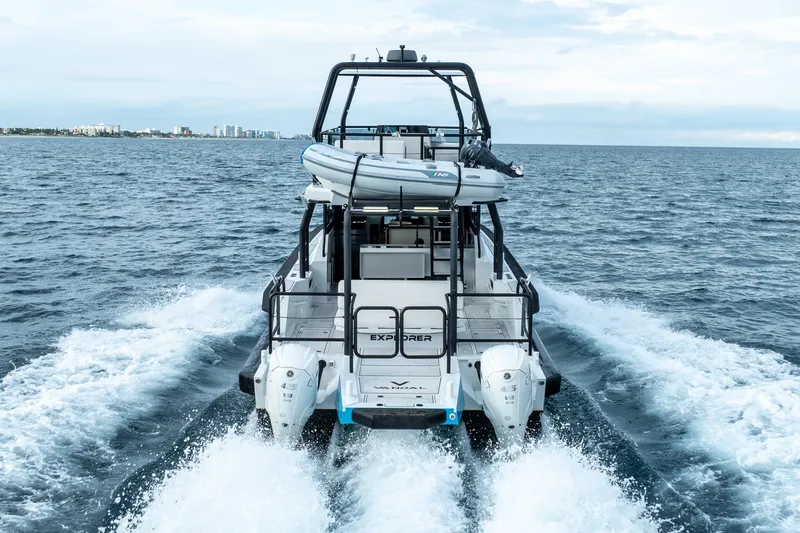 Slide: The Image of 2023 Vandal 46 Explorer yacht cruising on open sea, rear view. - 6