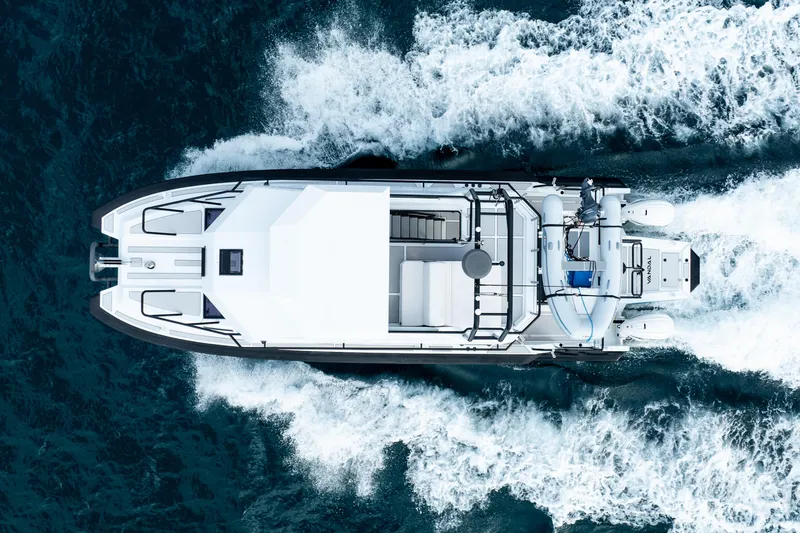 Slide: The Image of Aerial view of 2023 Vandal 46 Explorer yacht cruising through ocean waves. - 7