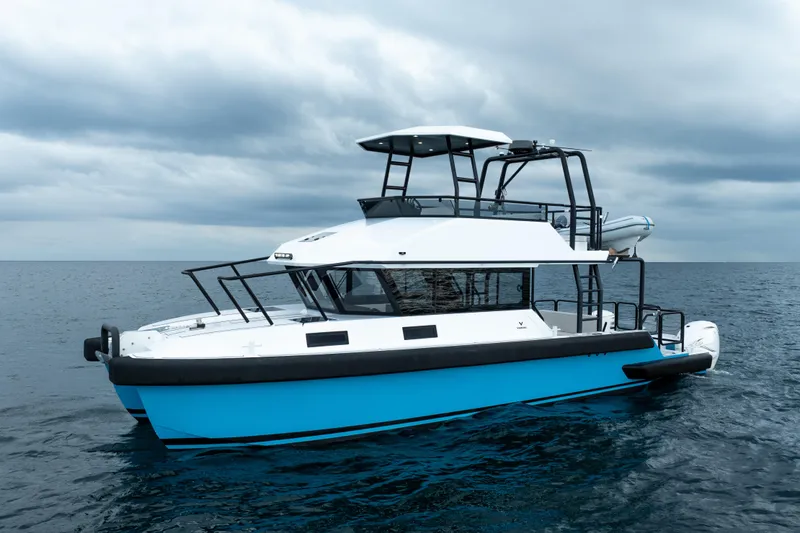 Slide: The Image of 2023 Vandal 46 Explorer boat on open sea under cloudy sky. - 9