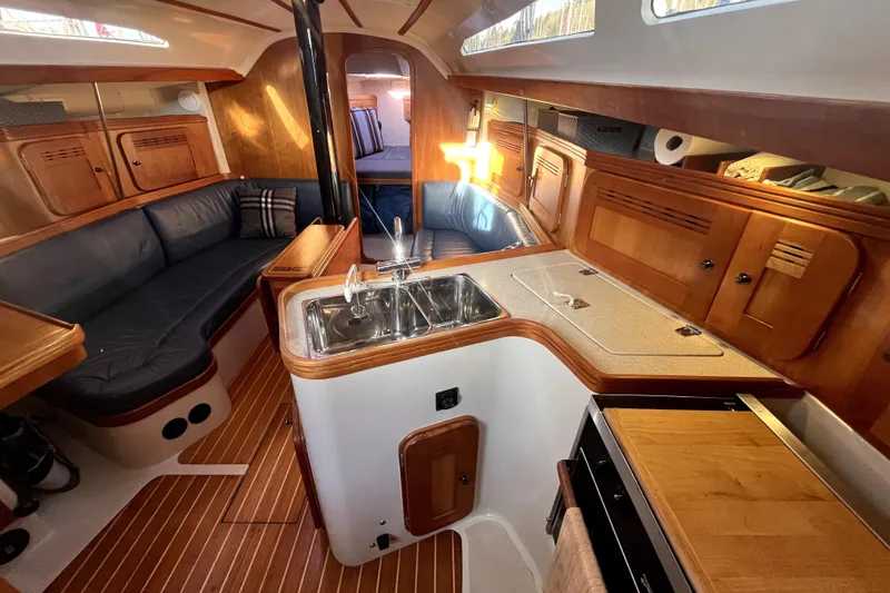 Slide: The Image of Luxurious 2005 C&C 110 yacht interior with wood finish and modern amenities. - 10