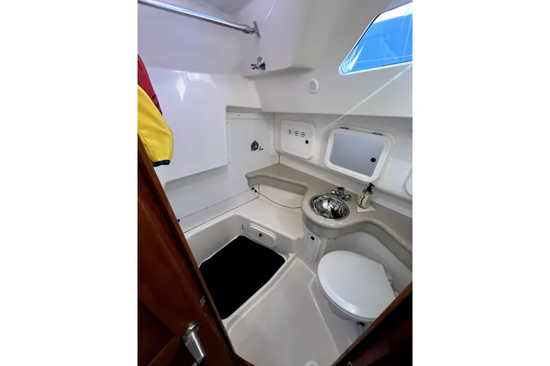 Slide: The Image of Compact bathroom in 2005 C&C 110 yacht with sink, toilet, and storage. - 15