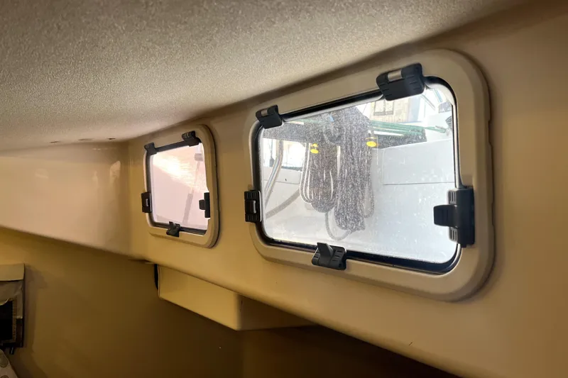 Slide: The Image of Interior view of a 2005 C&C 110 sailboat showing cabin windows and exterior ropes. - 19