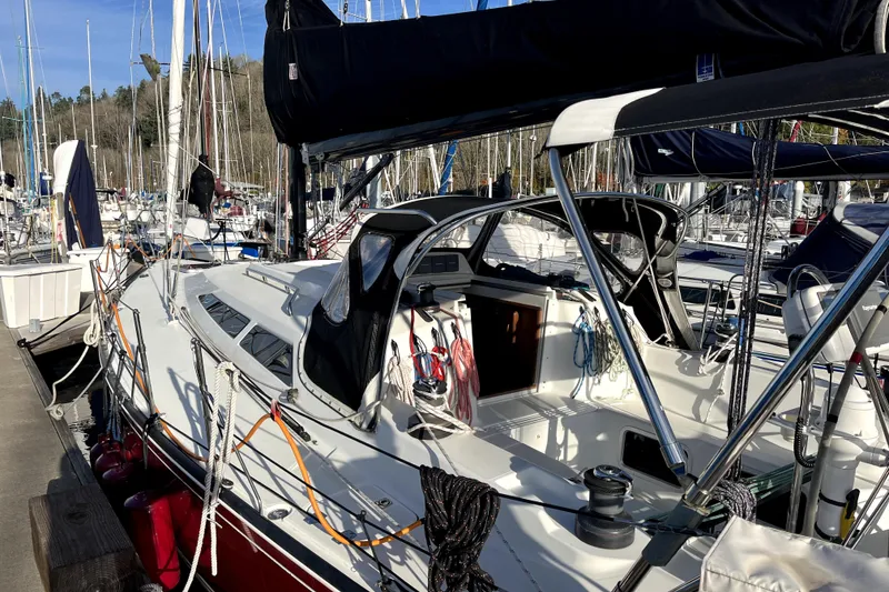 Slide: The Image of Sailboat C&C 110, 2005 model, docked at marina with clear blue sky. - 24