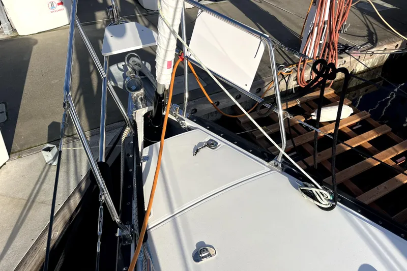 Slide: The Image of Deck view of a 2005 C&C 110 sailboat docked at a marina. - 28