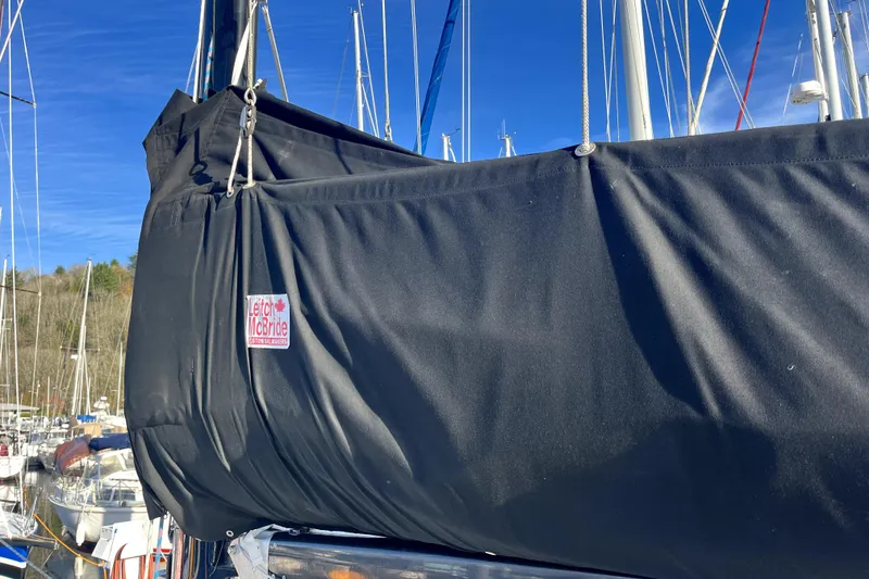 Slide: The Image of Sailboat with black sail cover in marina, C&C 110, 2005 model. - 32