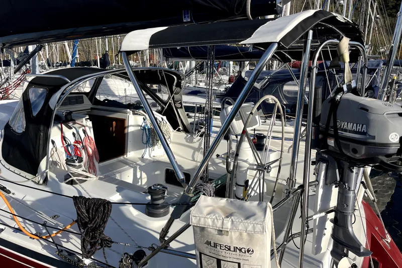 Slide: The Image of Sailboat cockpit with Yamaha motor, featuring ropes and Lifesling, C&C 110 model, 2005. - 35