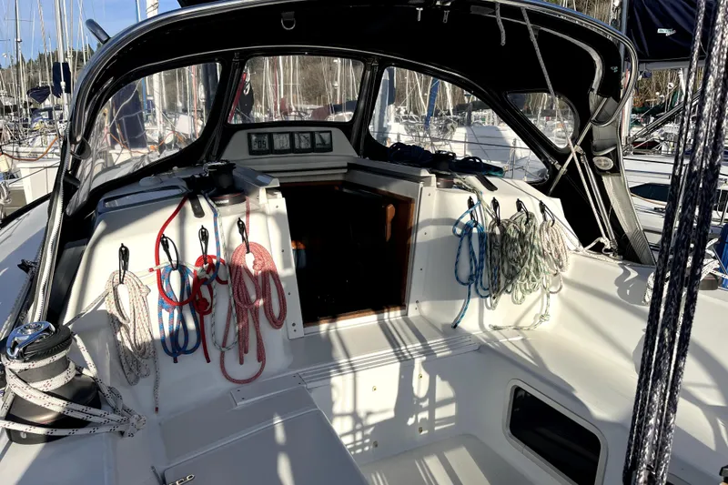 Slide: The Image of Cockpit of 2005 C&C 110 sailboat with ropes and winches, docked at marina. - 36